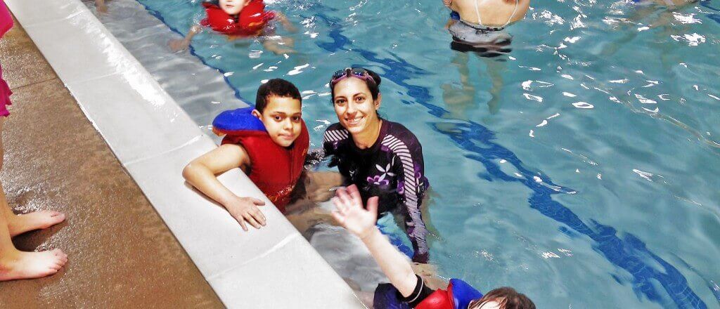 child and Holly of Peak Potential Therapy at special needs summer camp