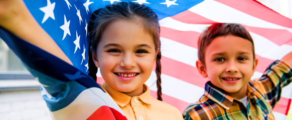 Girl And Boy With The American Flag