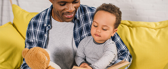 Dad reading with toddler