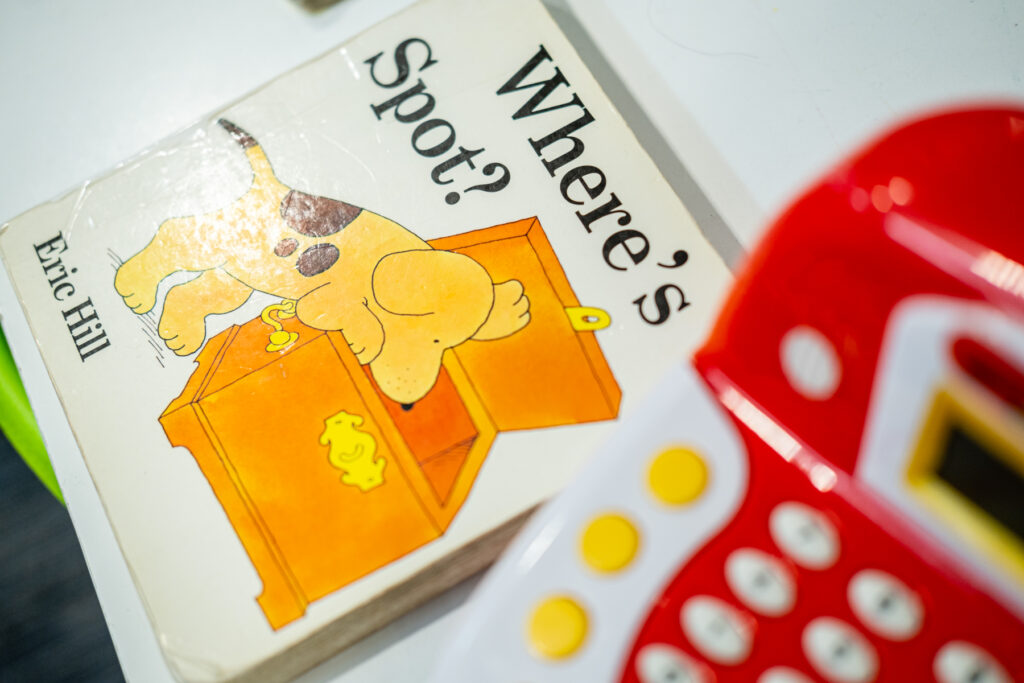 Children's book titled "Where's Spot?" visible.