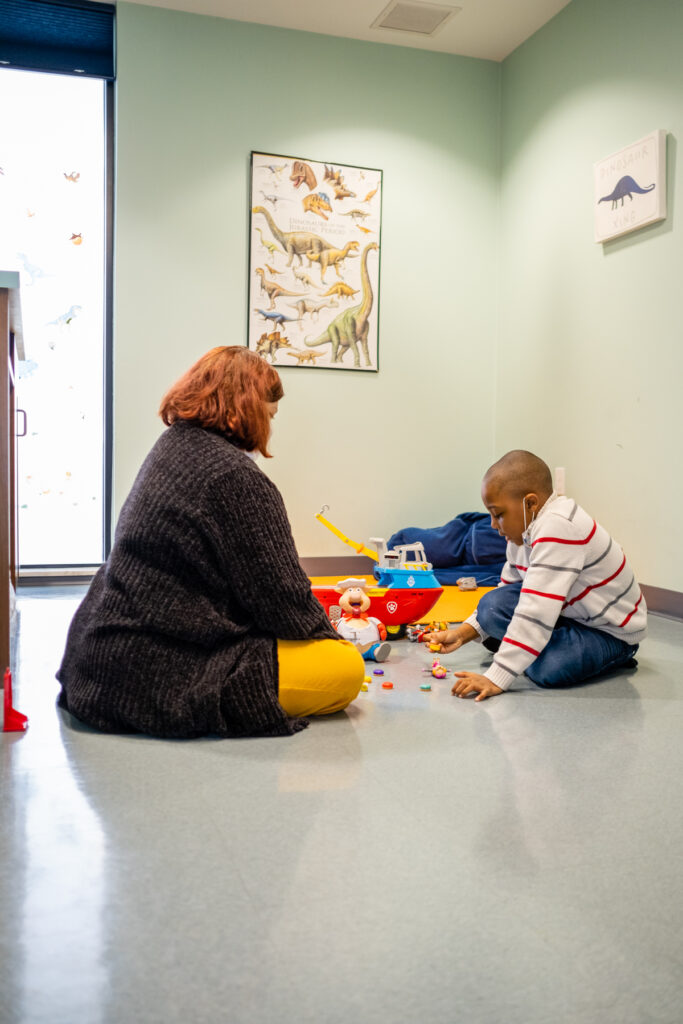 A therapist with a boy